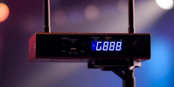 The PG88 wireless microphone receiver with LED indicators and rugged design, ideal for live performances and sound setups for professionals.